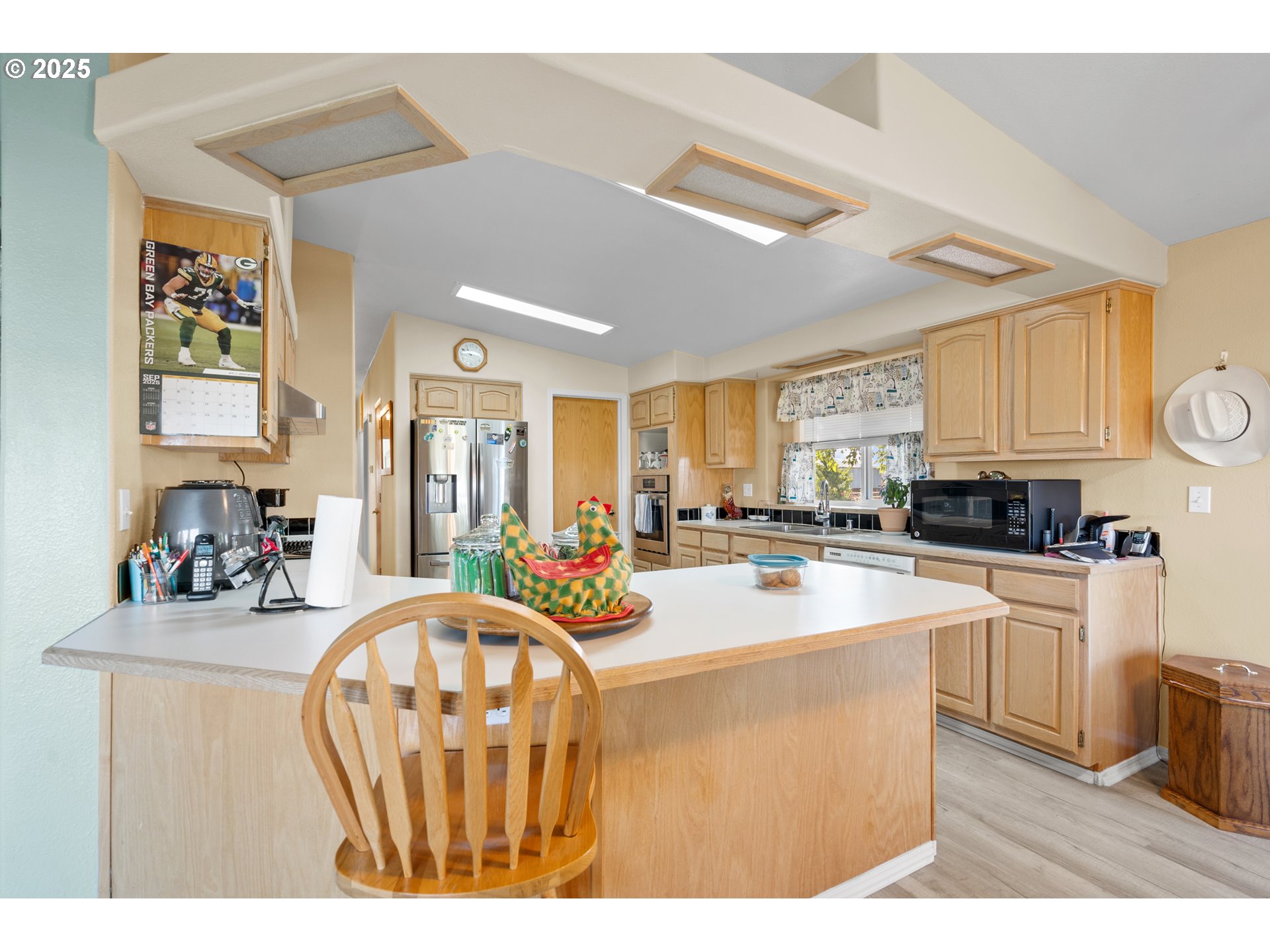 34656 County 1172 Road Stanfield, OR 97875 - Photo 33 of 47 a living room with stainless steel appliances kitchen island granite countertop a table chairs in it and a window