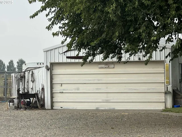 a view of a lake with a house and a big yard