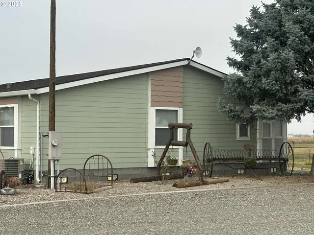 a living room filled with furniture and a chandelier