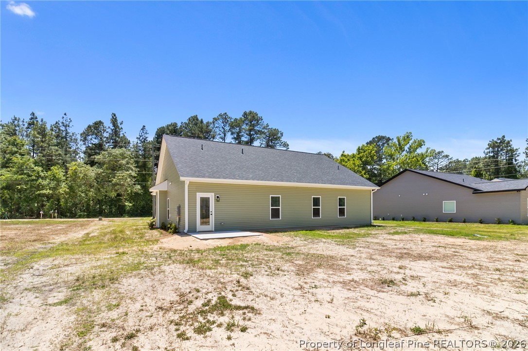 131 Merle Road Pinebluff, NC 28373 - Photo 31 of 33 a view of a house with a yard