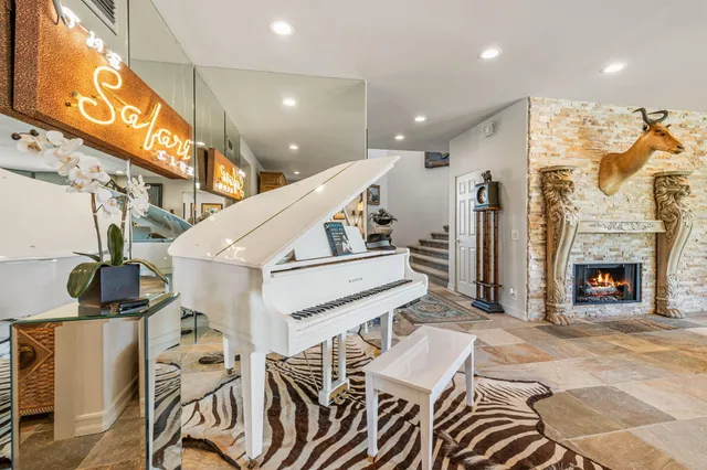 a view of a livingroom with furniture and a fireplace