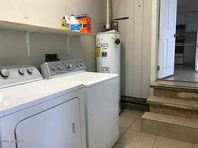 a utility room with dryer and washer