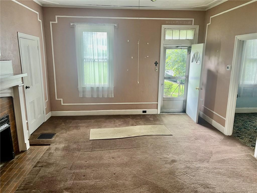 992 McCoy Road McKees Rocks, PA 15136 - Photo 2 of 9 an empty room with windows