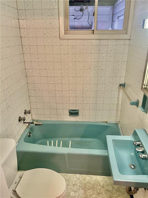 992 McCoy Road McKees Rocks, PA 15136 - Photo 6 of 9 a bathroom with a sink a toilet and bathtub