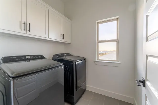 a kitchen with granite countertop a refrigerator and a sink