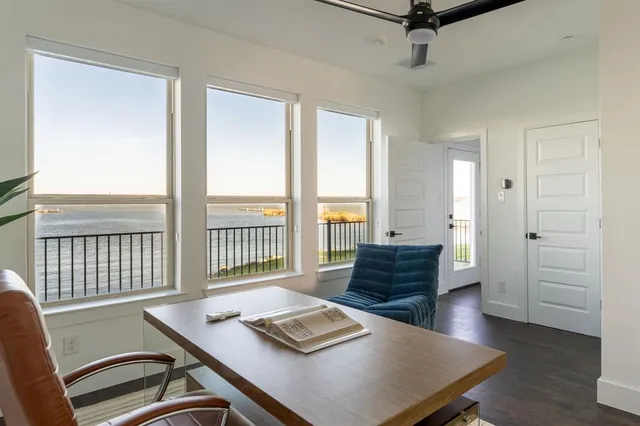 a view of a livingroom with furniture and a window