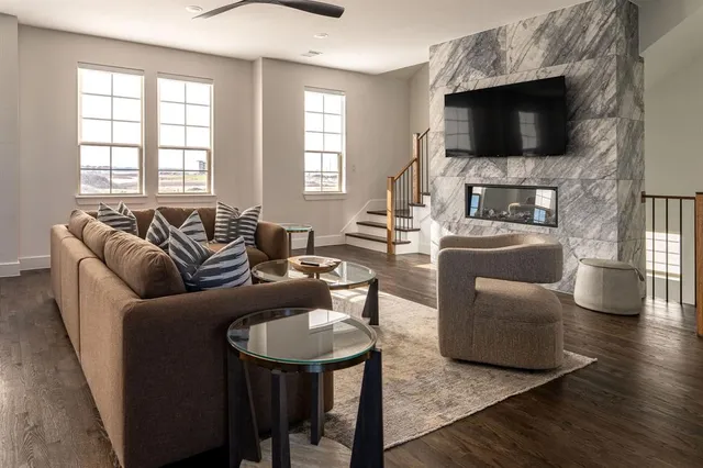 a living room with fireplace furniture and a flat screen tv