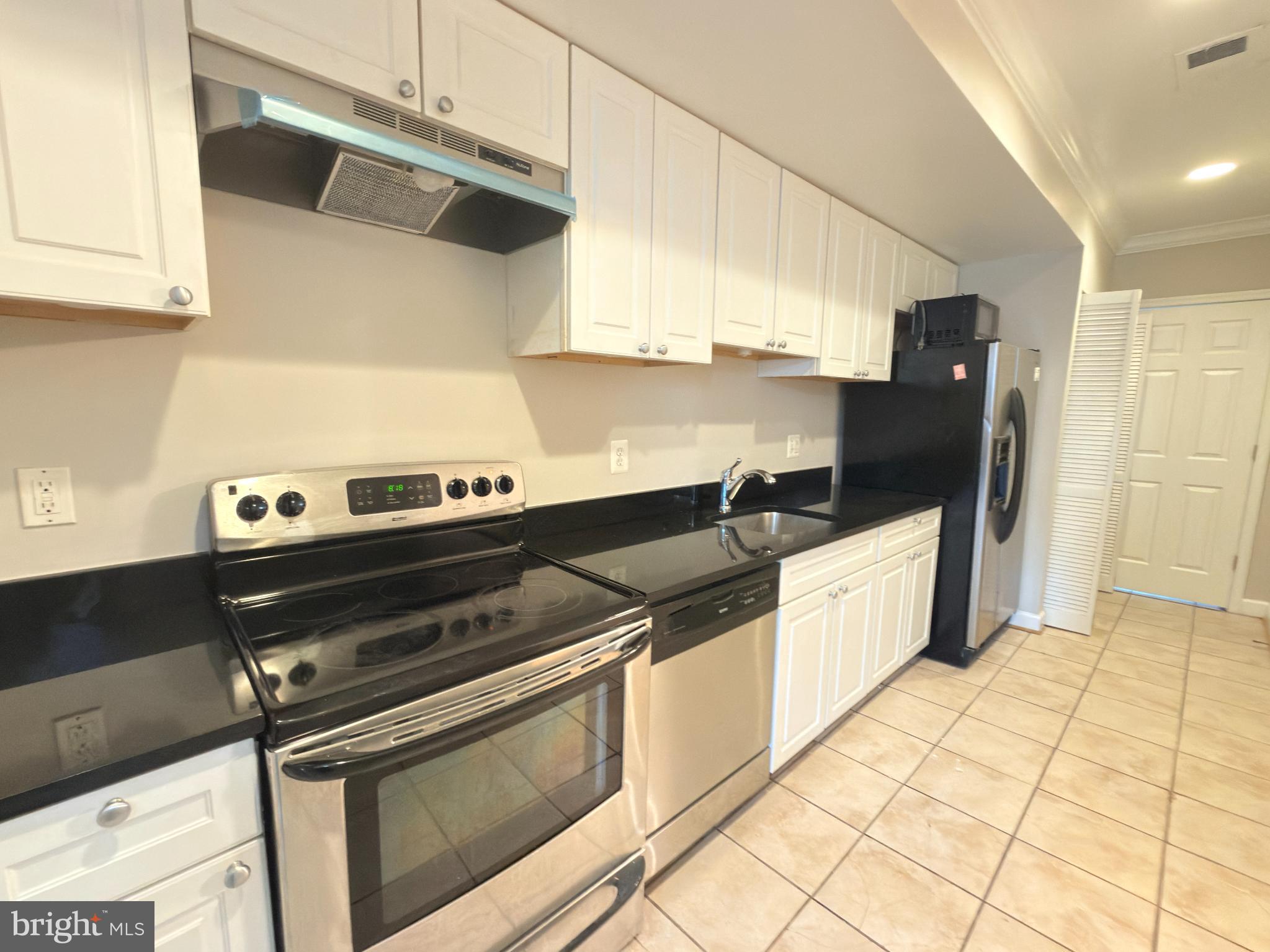 1246 Queen Street Northeast, Unit 2 Washington, DC 20002 - Photo 10 of 23 Modern kitchen with sleek finishes.