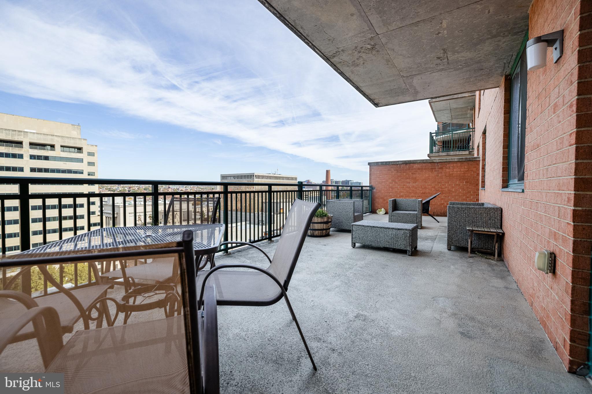 414 Water Street, Unit 1108 Baltimore, MD 21202 - Photo 12 of 36 a view of a terrace with chairs