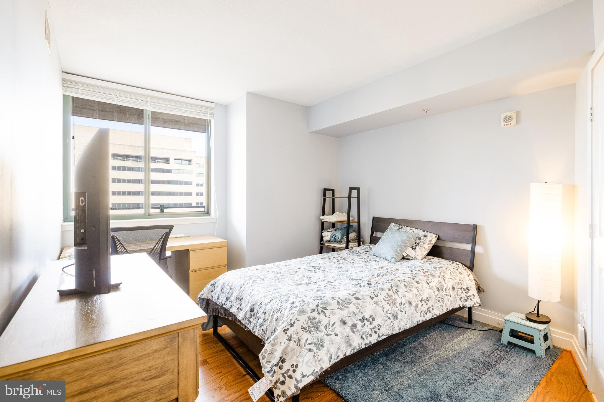 414 Water Street, Unit 1108 Baltimore, MD 21202 - Photo 14 of 36 a bedroom with a bed and window