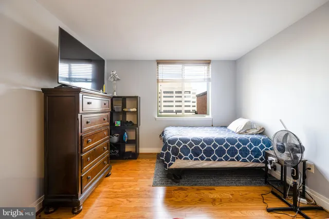 a bedroom with a bed and a couch