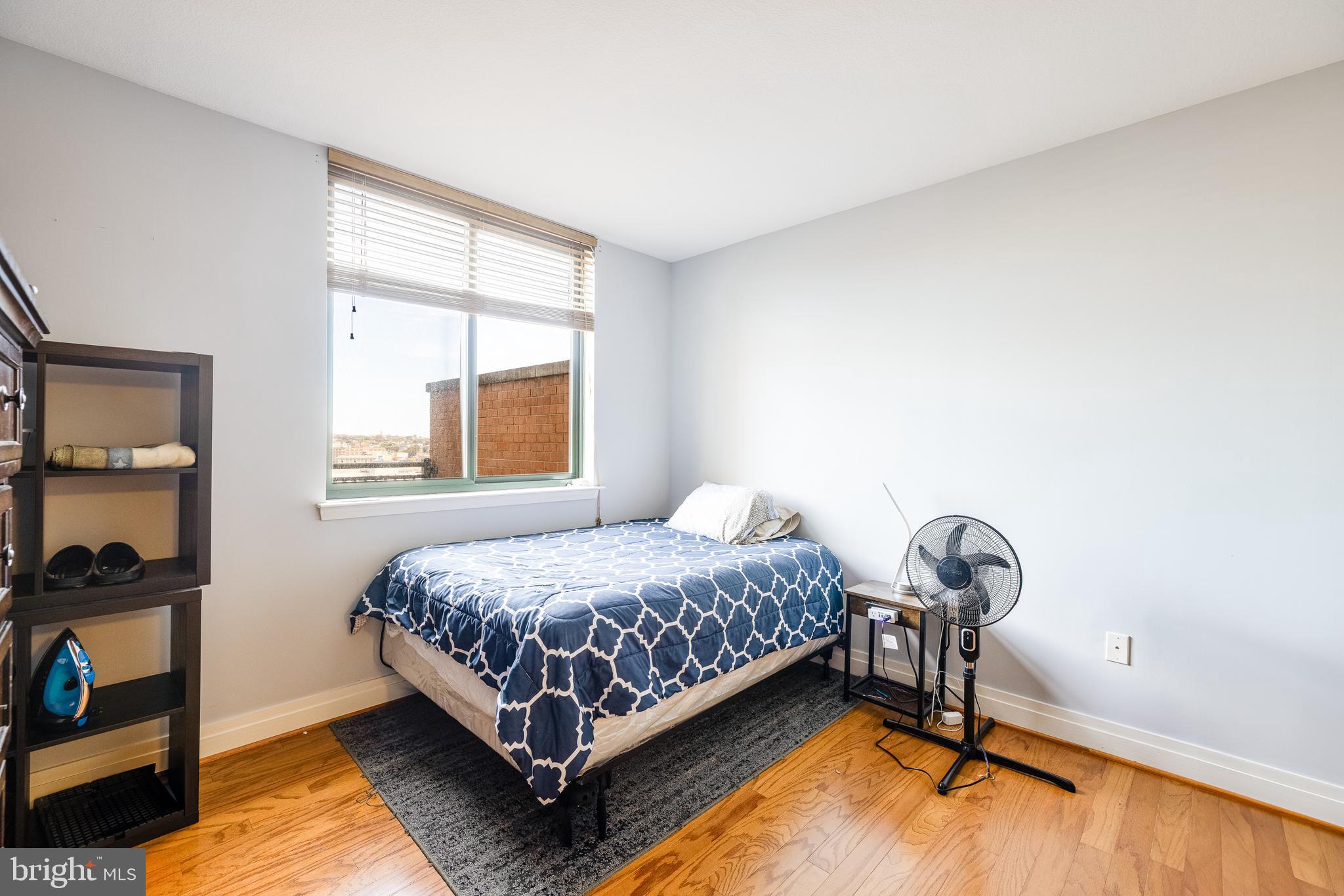 414 Water Street, Unit 1108 Baltimore, MD 21202 - Photo 25 of 36 a bedroom with a bed and a window