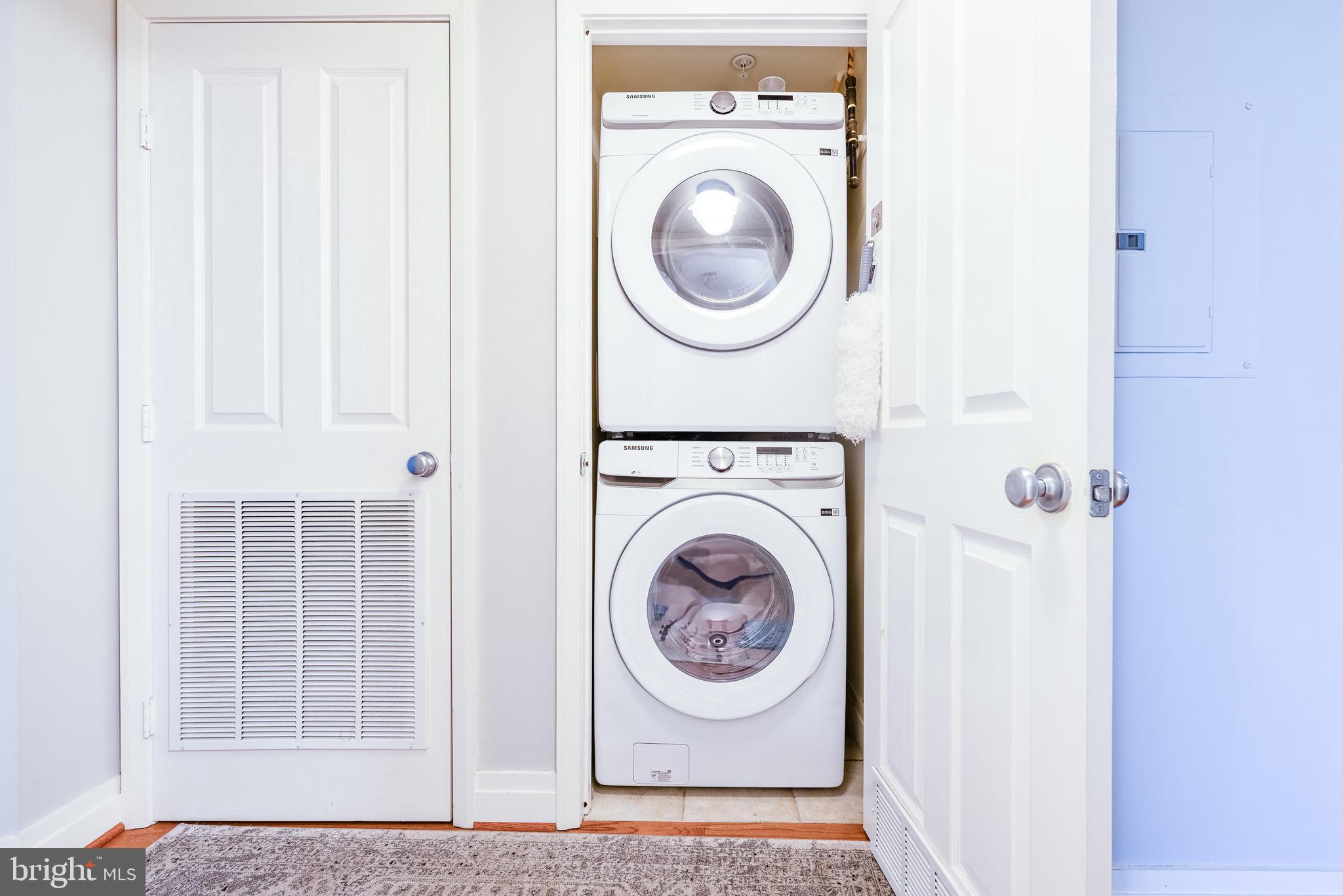 414 Water Street, Unit 1108 Baltimore, MD 21202 - Photo 28 of 36 a utility room with dryer and washer