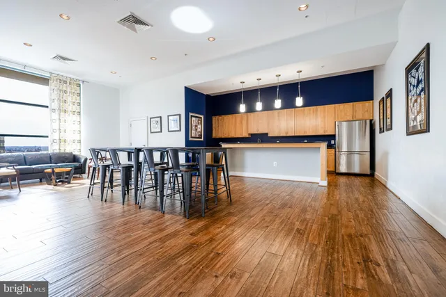 a dining room with furniture and wooden floor