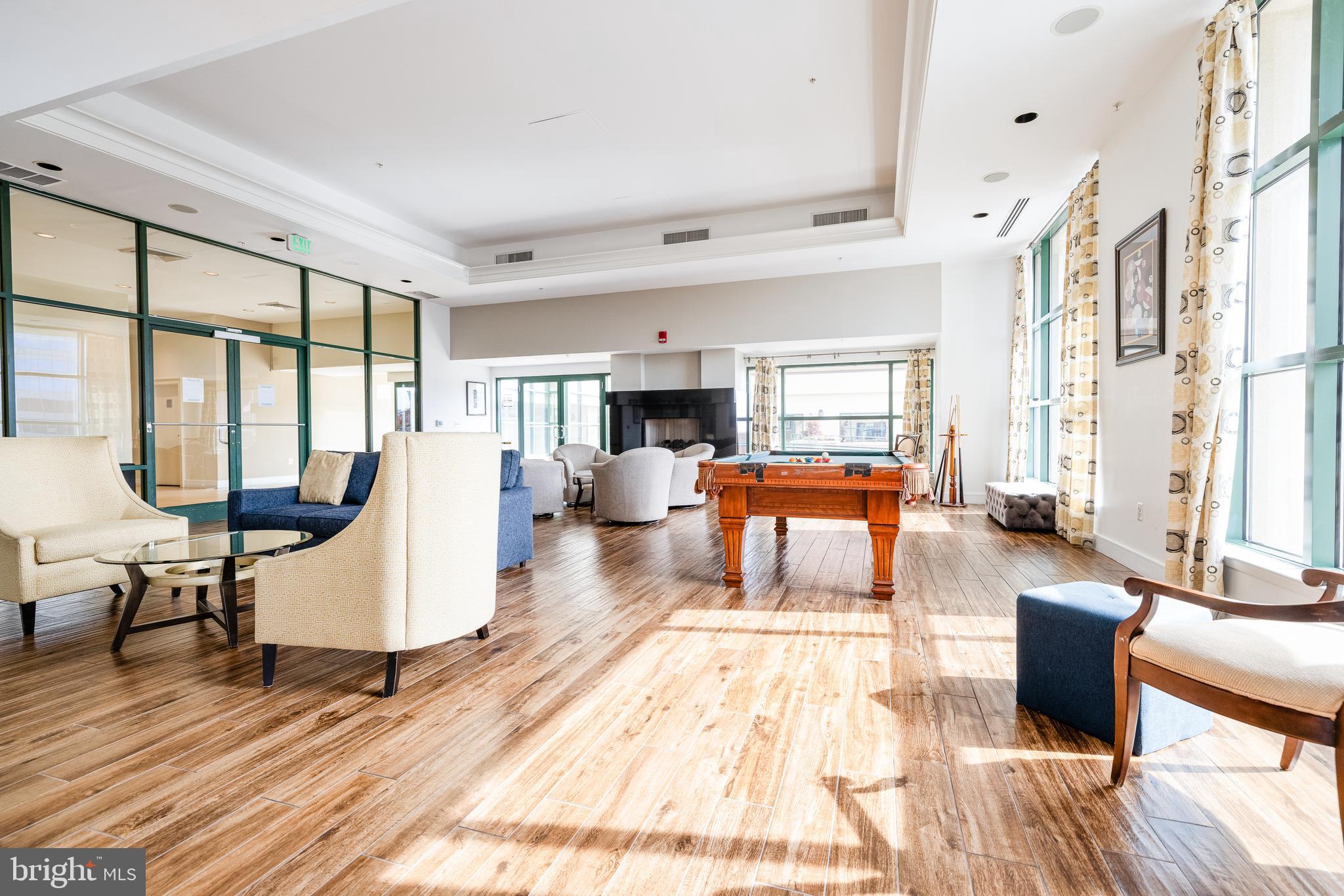 414 Water Street, Unit 1108 Baltimore, MD 21202 - Photo 35 of 36 a living room with furniture large window and wooden floor