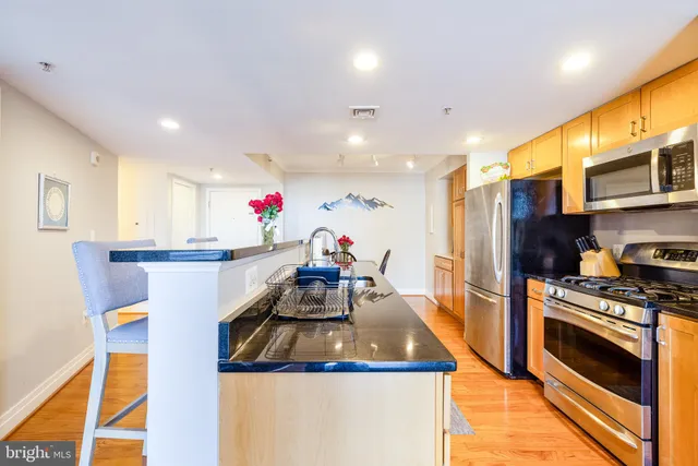 a living room with fireplace furniture and a wooden floor