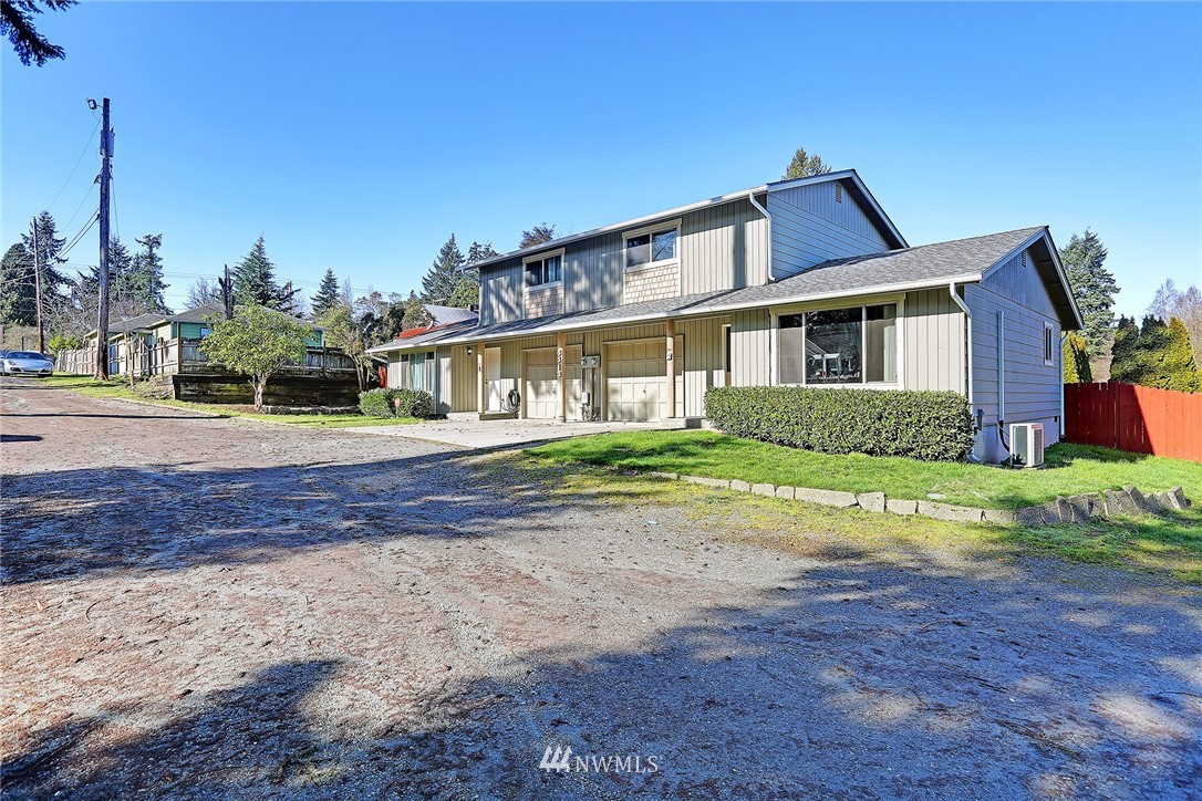 6513 Cady Road Everett, WA 98203 - Photo 3 of 11 a front view of a house with a yard