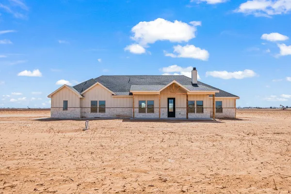 a front of a house with a yard