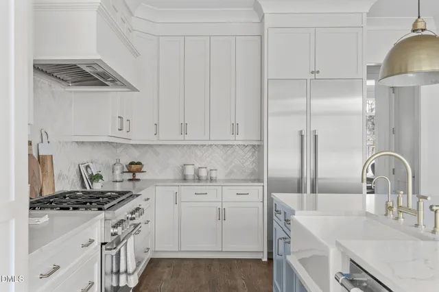 a kitchen with a refrigerator and cabinets