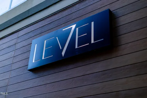 a sign that is sitting on a sidewalk