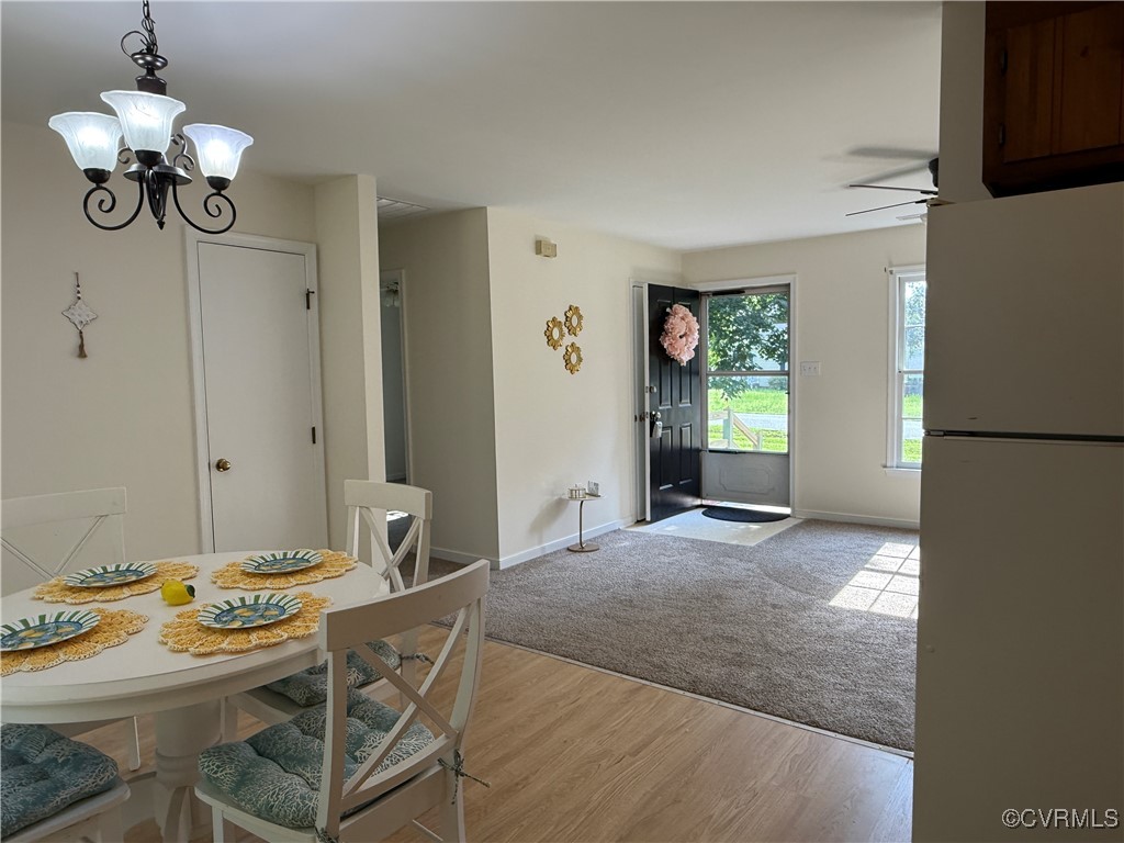 4825 Wilconna Road Chesterfield, VA 23832 - Photo 5 of 18 a view of a dining room with furniture window and wooden floor