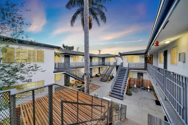 a view of balcony with wooden floor and outdoor seating