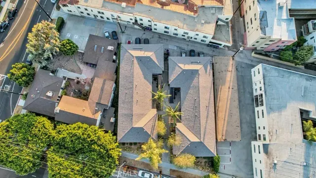 an aerial view of residential houses with outdoor space