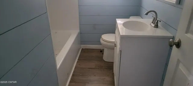 a bathroom with a sink and toilet