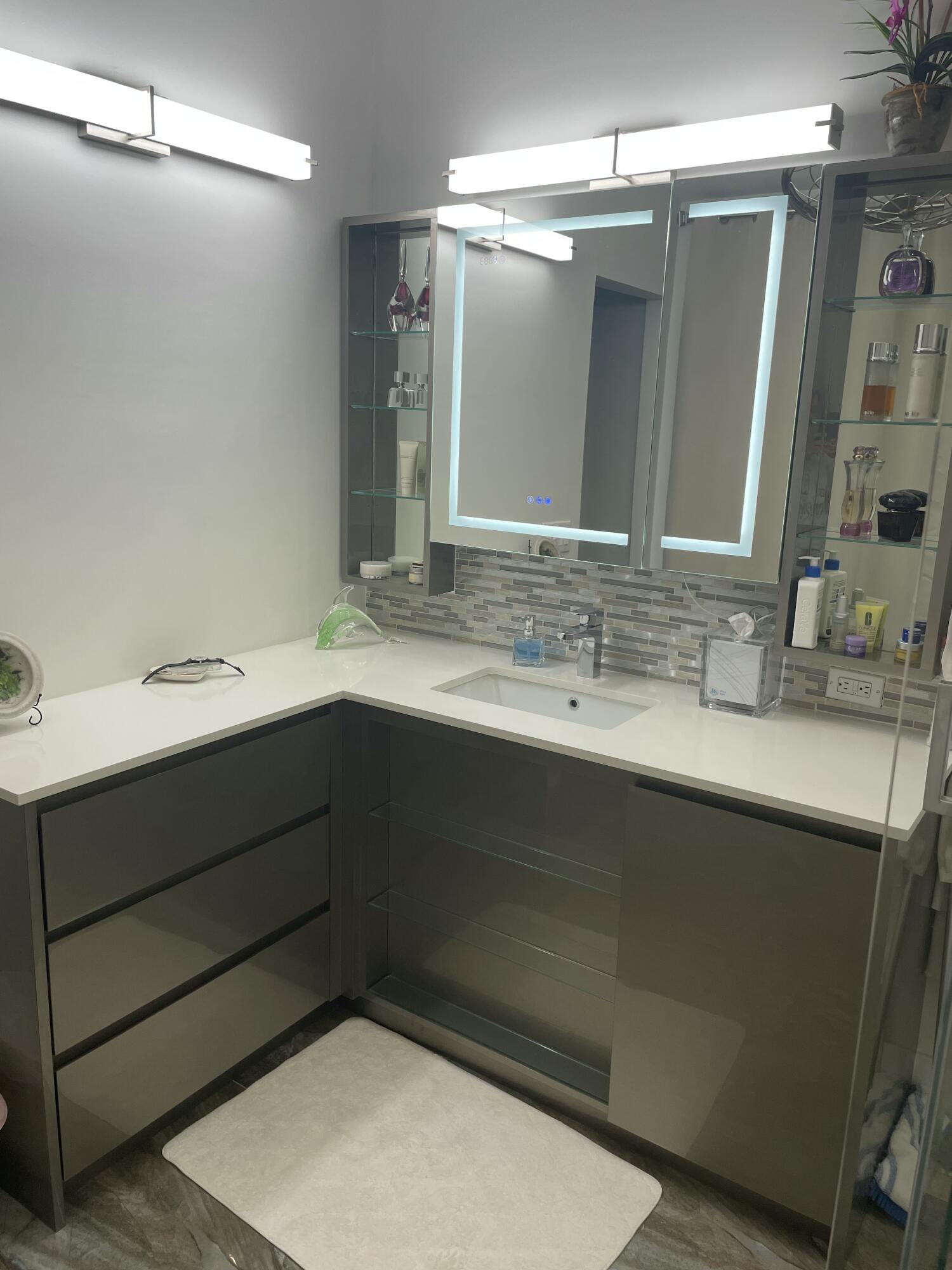 22305 Whistling Pines Lane Boca Raton, FL 33428 - Photo 13 of 16 a bathroom with a sink double vanity and a mirror