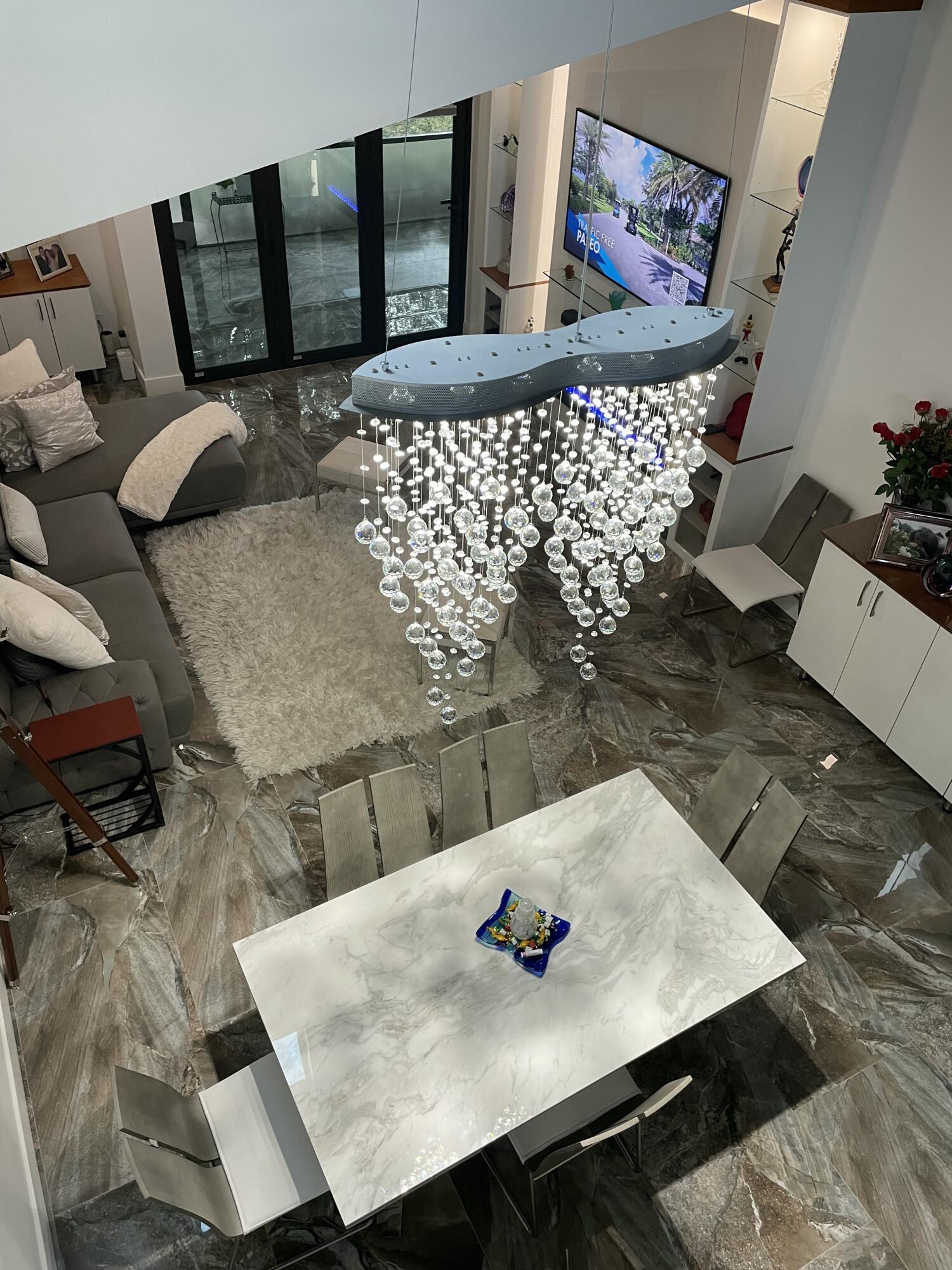 22305 Whistling Pines Lane Boca Raton, FL 33428 - Photo 14 of 16 a living room with furniture rug and wooden floor