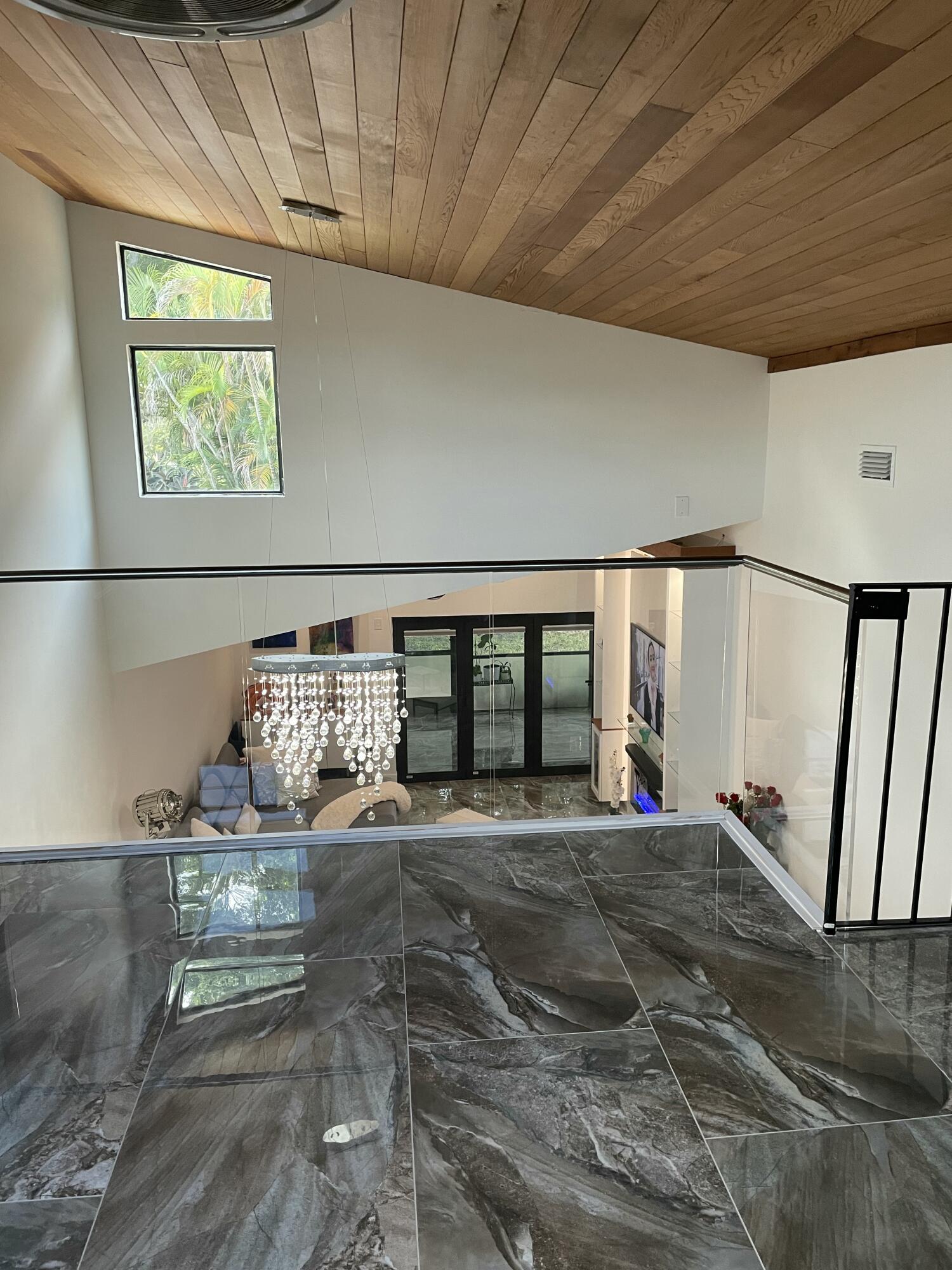 22305 Whistling Pines Lane Boca Raton, FL 33428 - Photo 15 of 16 a view of a livingroom with wooden floor