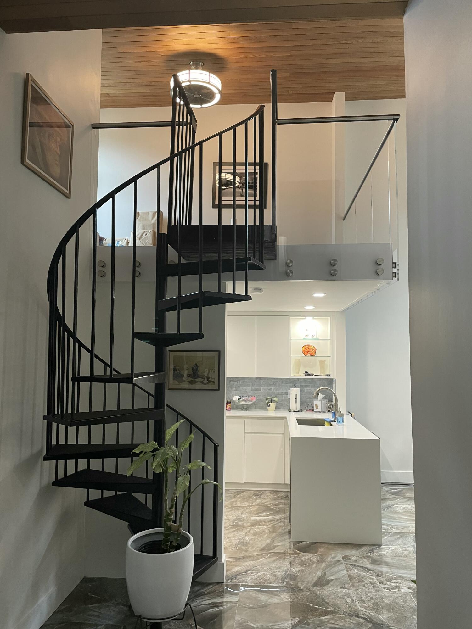 22305 Whistling Pines Lane Boca Raton, FL 33428 - Photo 4 of 16 a room with lots of wooden cabinets