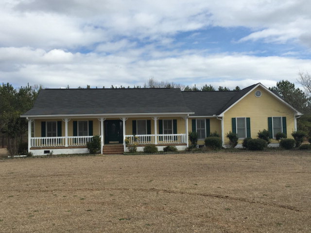 5016 Hartley Bridge Road Macon, GA 31216 - Photo 1 of 27 front view of a house with a patio