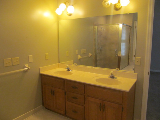 5016 Hartley Bridge Road Macon, GA 31216 - Photo 18 of 27 a bathroom with a sink and a mirror