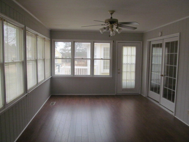 5016 Hartley Bridge Road Macon, GA 31216 - Photo 21 of 27 wooden floor in an empty room with a window