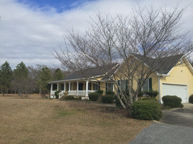 5016 Hartley Bridge Road Macon, GA 31216 - Photo 22 of 27 front view of a house with a street