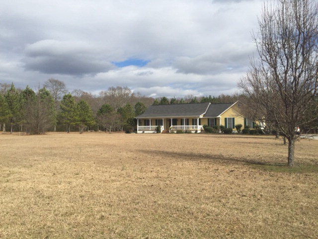 5016 Hartley Bridge Road Macon, GA 31216 - Photo 24 of 27 a view of a house with a yard
