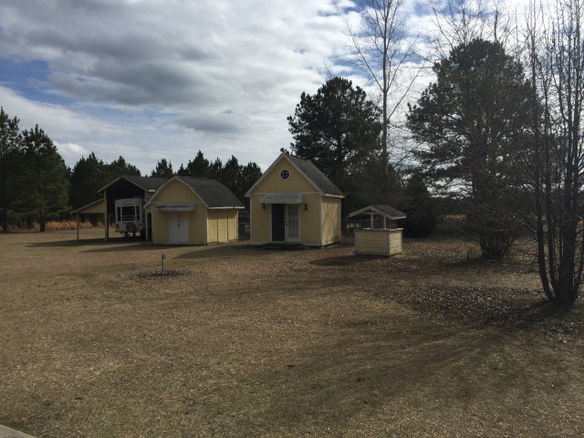 5016 Hartley Bridge Road Macon, GA 31216 - Photo 26 of 27 a front view of a house with a garden