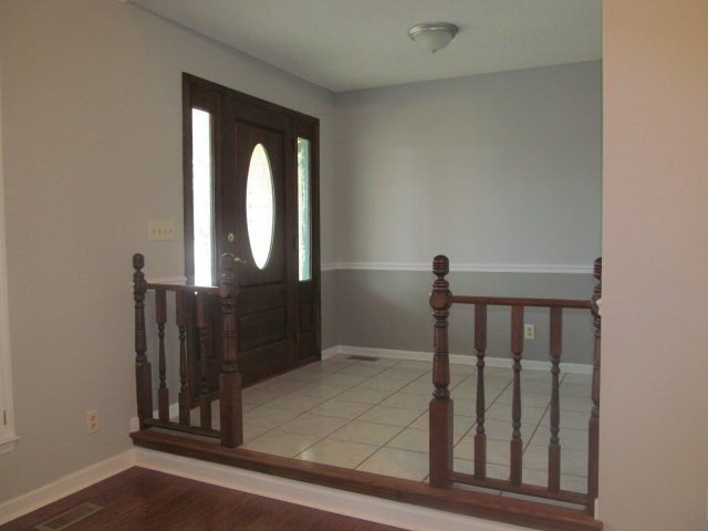 5016 Hartley Bridge Road Macon, GA 31216 - Photo 5 of 27 a view of staircase with railing and a window