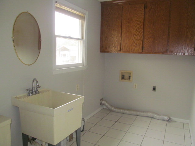 5016 Hartley Bridge Road Macon, GA 31216 - Photo 7 of 27 a bathroom with a sink and a window