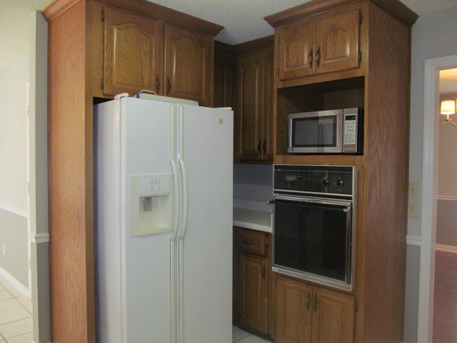 5016 Hartley Bridge Road Macon, GA 31216 - Photo 10 of 27 a close view of a refrigerator and a stove top oven