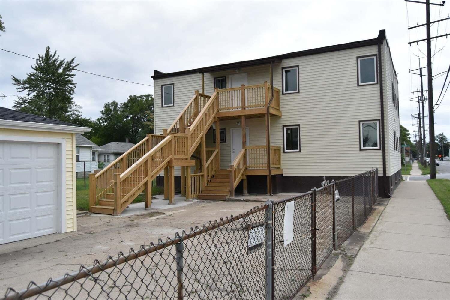 5664 Walter Avenue Hammond, IN 46320 - Photo 5 of 13 a view of a house with wooden stairs