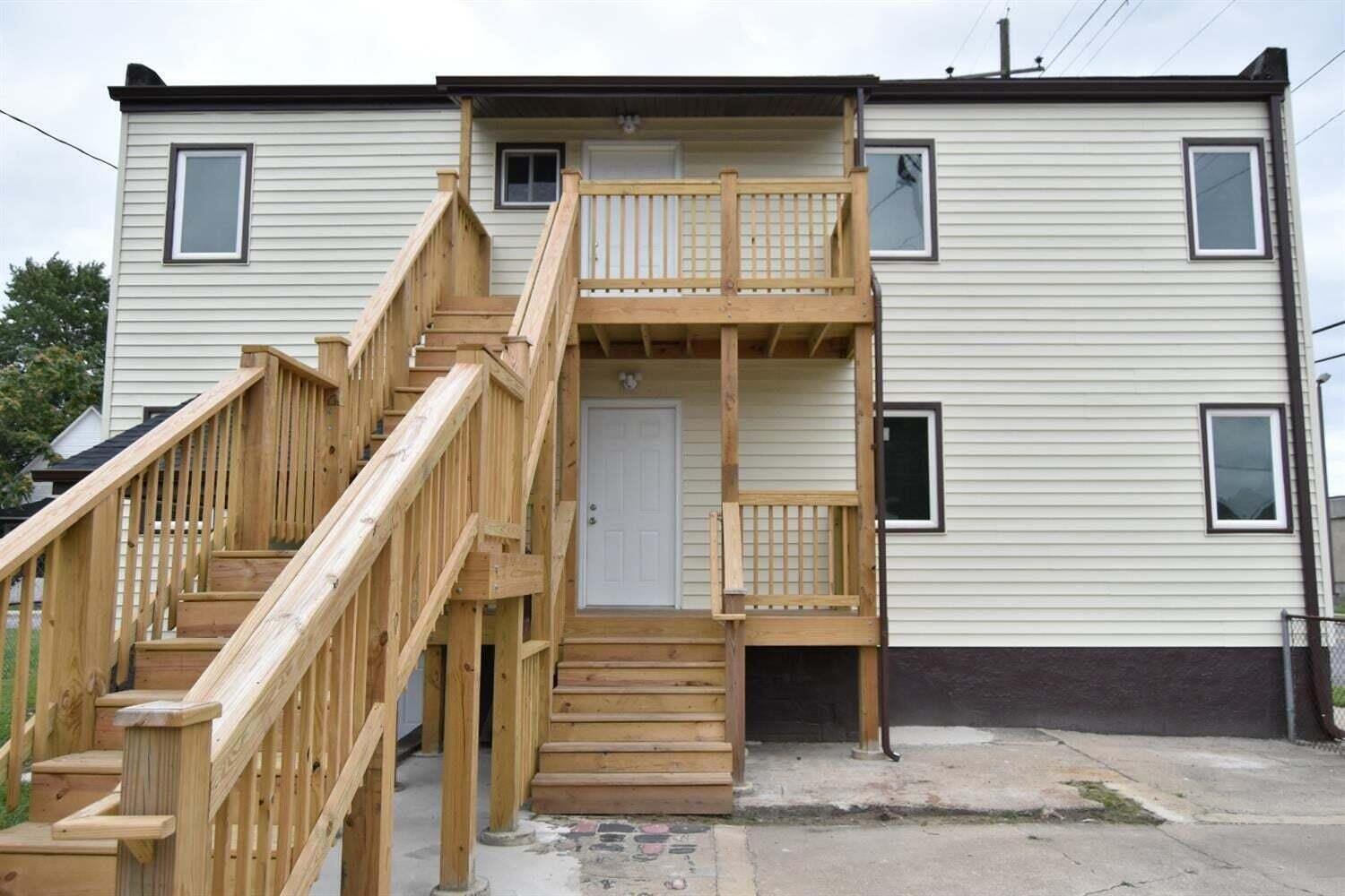 5664 Walter Avenue Hammond, IN 46320 - Photo 6 of 13 a front view of a house with wooden stairs