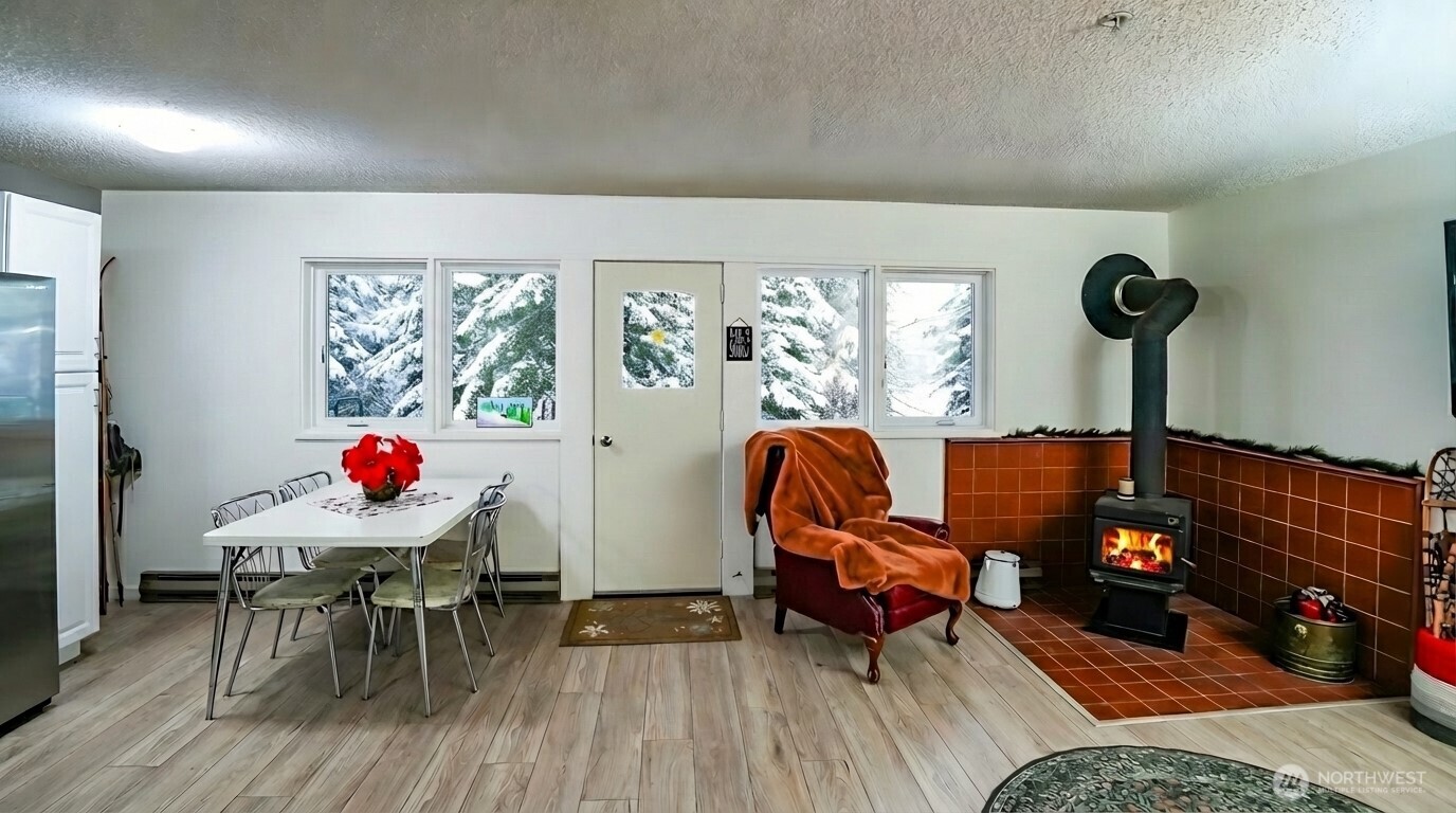 220 Tanner Way, Unit 206 Snoqualmie Pass, WA 98068 - Photo 12 of 37 a living room with furniture and a potted plant