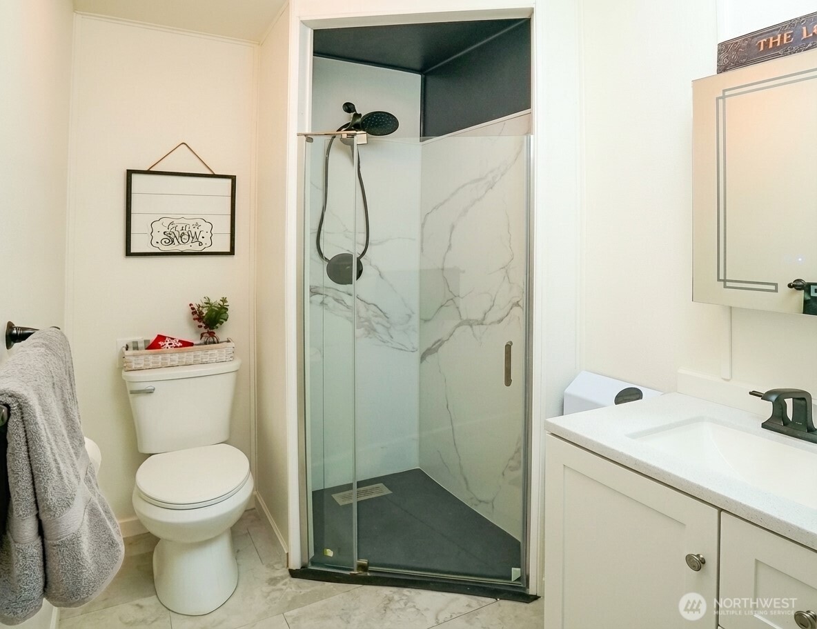 220 Tanner Way, Unit 206 Snoqualmie Pass, WA 98068 - Photo 19 of 37 a bathroom with a toilet and a shower