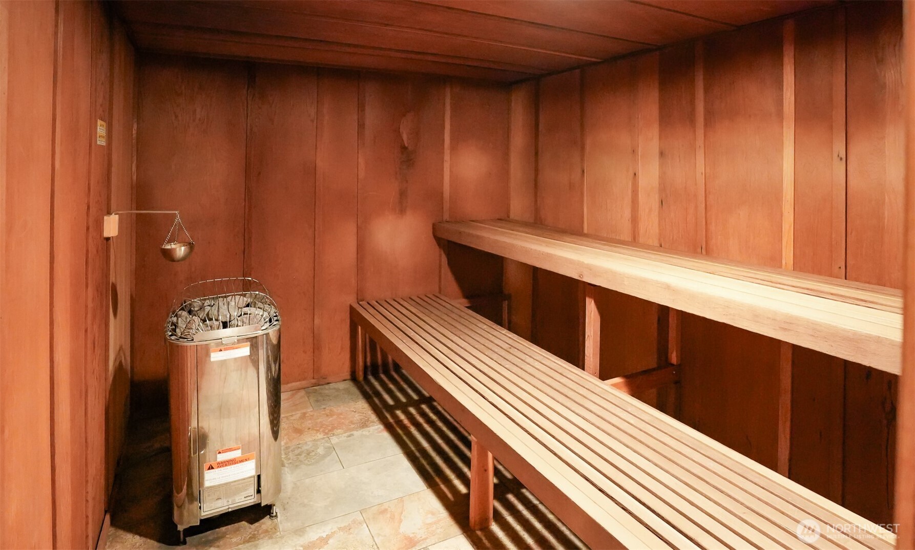 220 Tanner Way, Unit 206 Snoqualmie Pass, WA 98068 - Photo 29 of 37 a kitchen with wooden cabinets and a sink