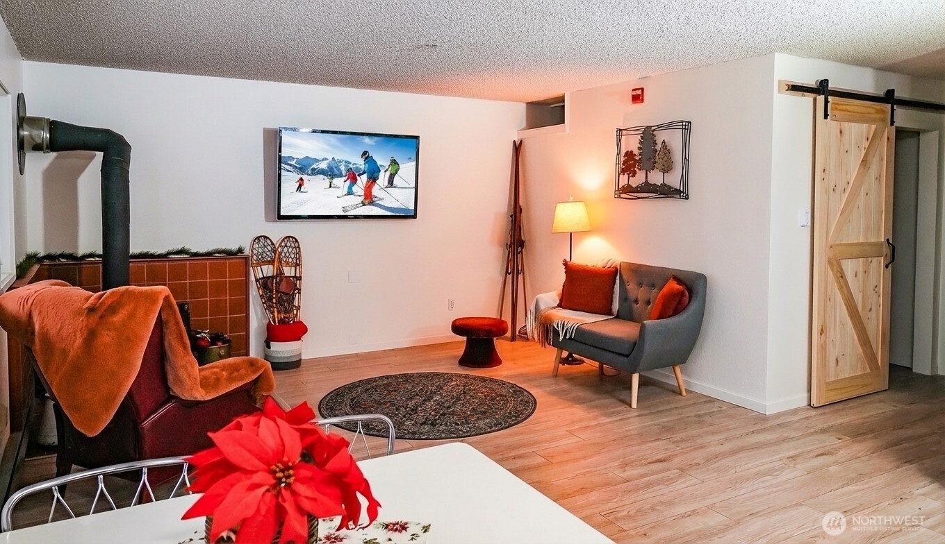 220 Tanner Way, Unit 206 Snoqualmie Pass, WA 98068 - Photo 7 of 37 a living room with furniture and a couch