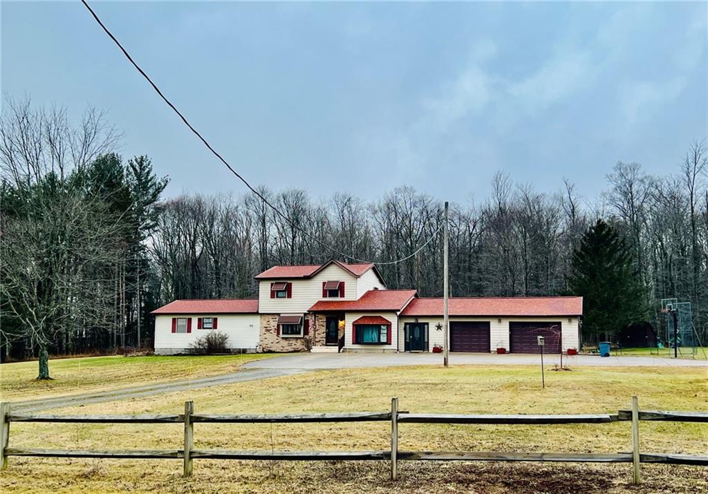 a view of a house with a big yard