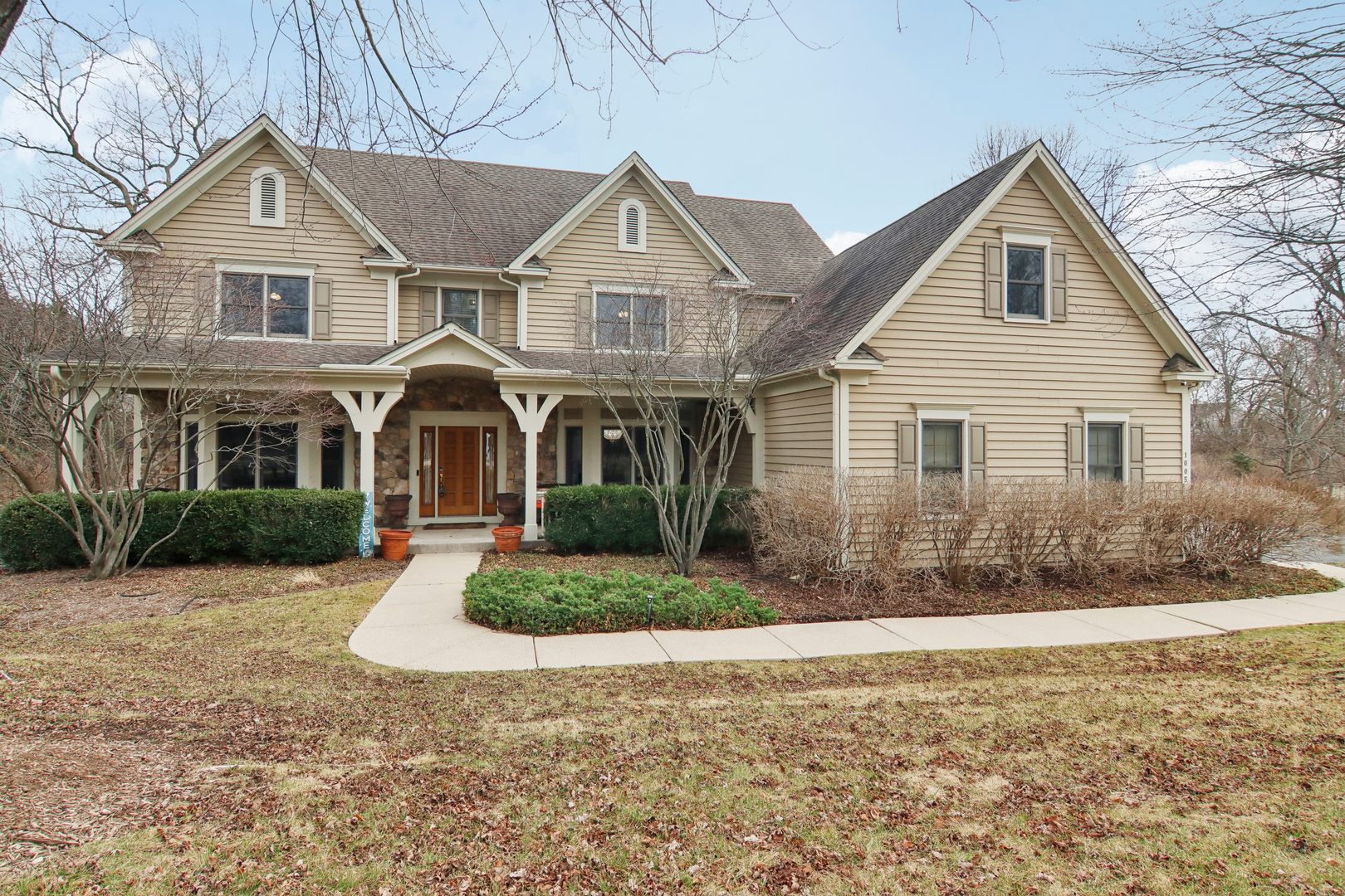 a front view of a house with a yard