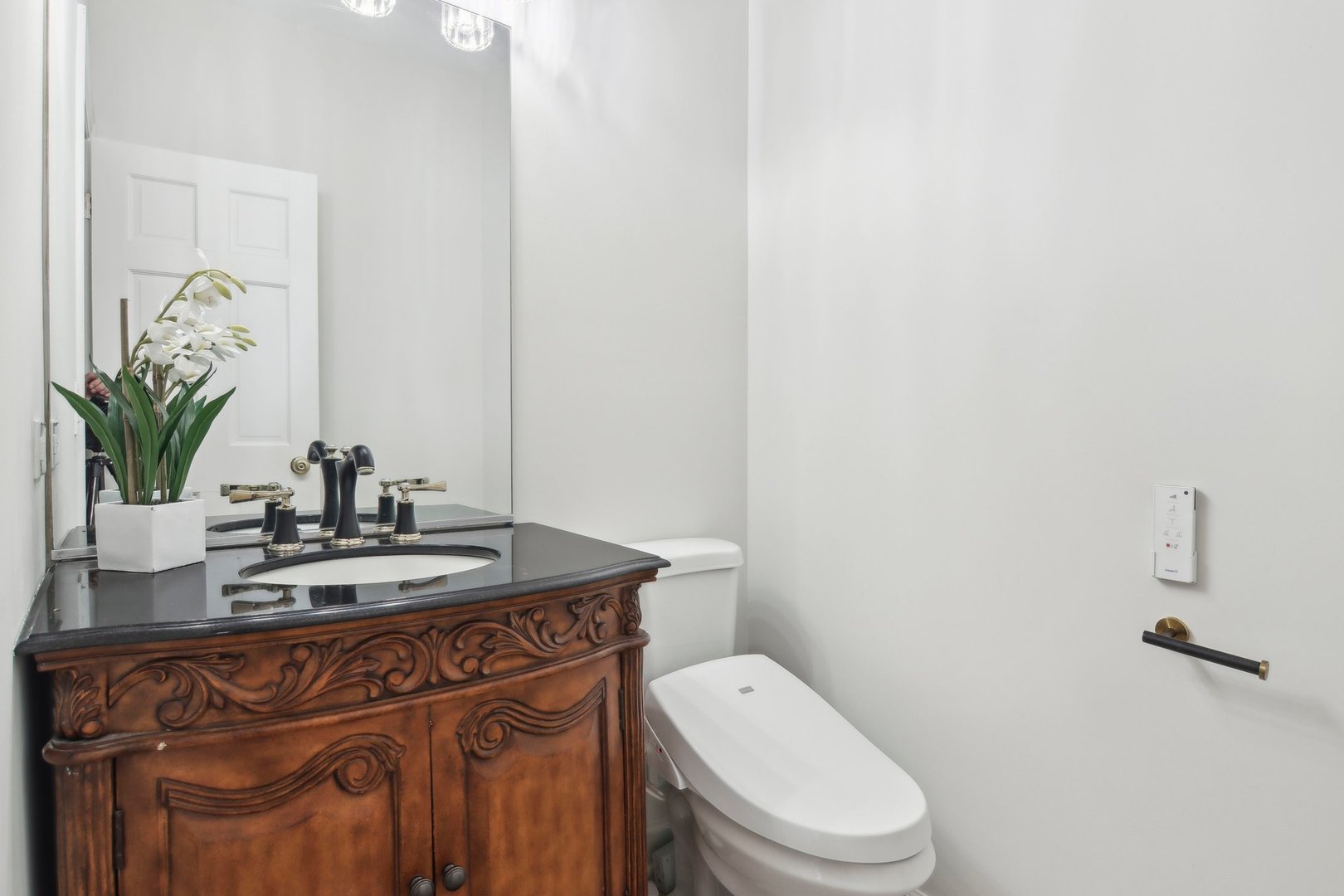 1005 Bridle Lane Cary, IL 60013 - Photo 20 of 64 a bathroom with a granite countertop toilet sink and mirror